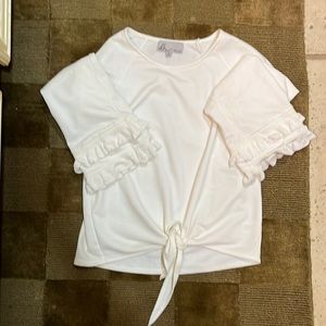 White boutique sweater with ruffle hem sleeves and flirty tie front.